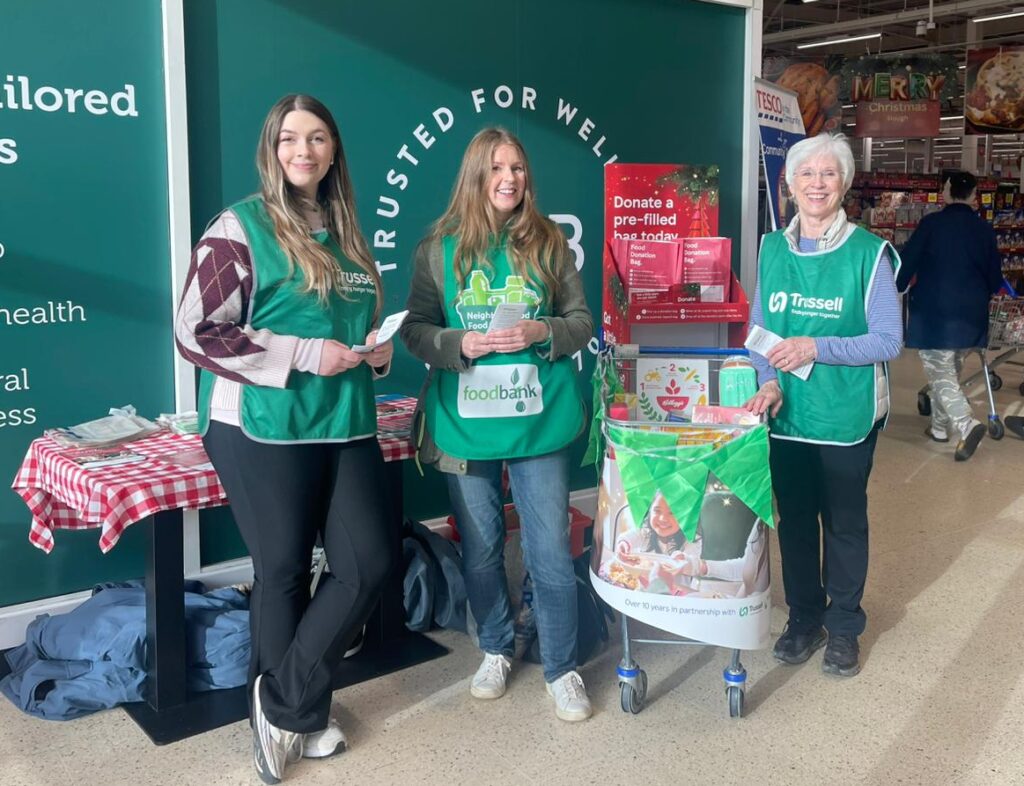 Volunteers standing by a collection point in Tesco