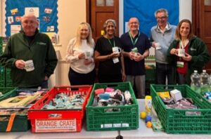 Volunteers at Slough Distribution Centre pose with some crates